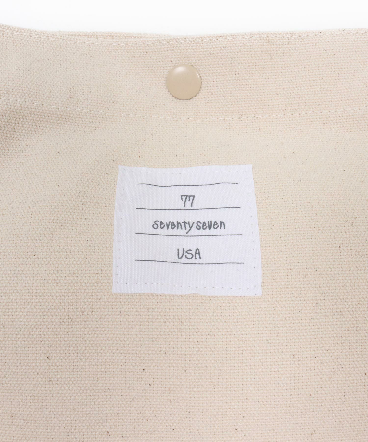 seventy seven(セブンティセブン)】embroidery newspaper bag(77arch
