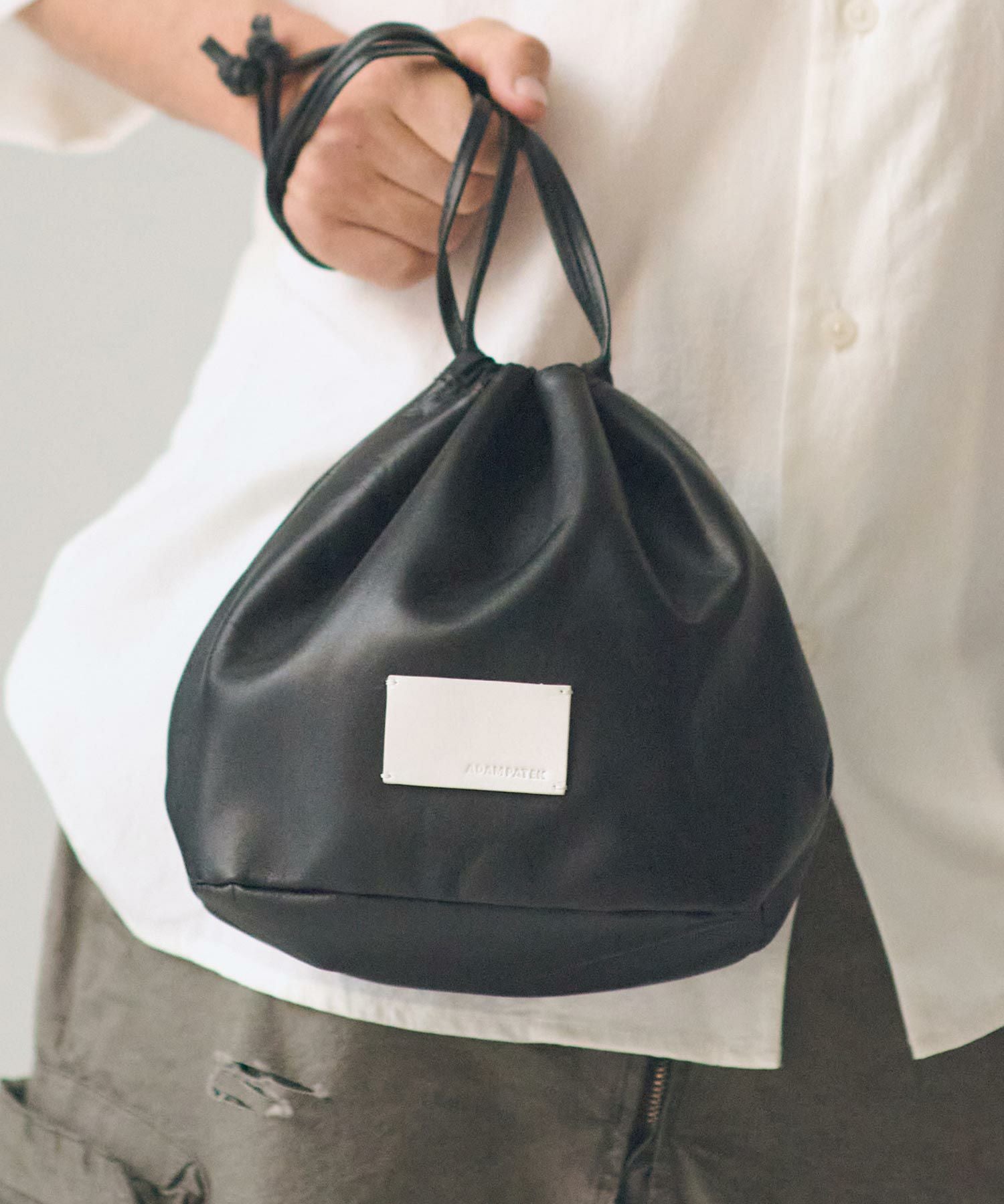 ADAM PATEK(アダムパテック)】water repellent leather drawstring bag